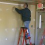 Chris spackling holes.